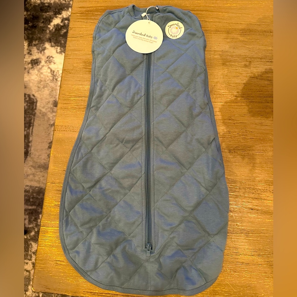Brand new with tags dreamland weighted swaddle. Never used.
